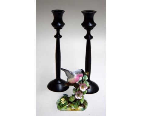 A ceramic Crown Staffordshire bird figurine, designed and modelled by JT Jones, together with two wooden candlestick holders