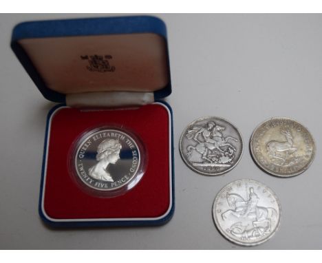 A Victorian 1890 silver crown coin, 1oz, a 1949 South African silver five shilling piece with the head of George VI, 1oz, a B