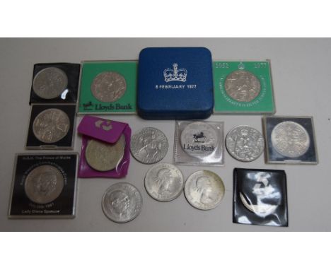 An assortment of commemorative coins, with examples including coins to mark the The Queen's Silver Jubilee, the marriage of P