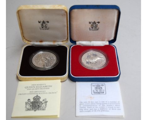 A sterling silver proof crown coin issued in 1980 to commemorate the 80th Birthday of the Queen Mother, together with a sterl