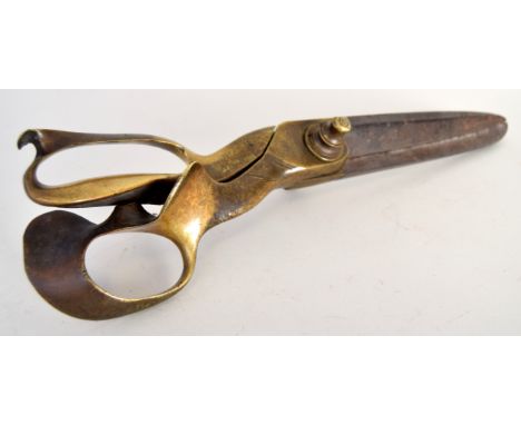 A pair of late Victorian steel end brass 14 inch drapery scissors by Wilkinson & Co., in good condition