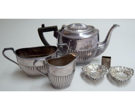 A pair of silver trinket dishes with pierced floriate and bow decoration and a silver match box, Birmingham 1901, together wi