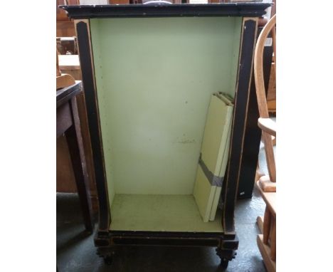 A black painted book shelf of two shelves