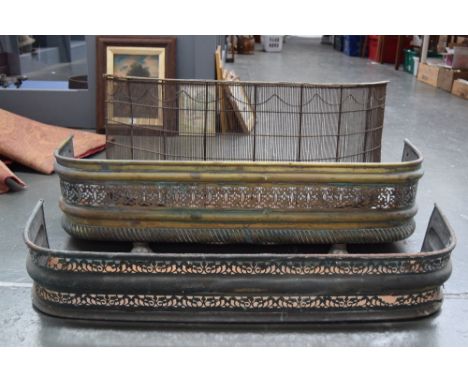 Three cast iron fire fenders, one with paw feet and pierced foliate panel, 105cmL and 28cmH, another similar, 100cmL and 22cm