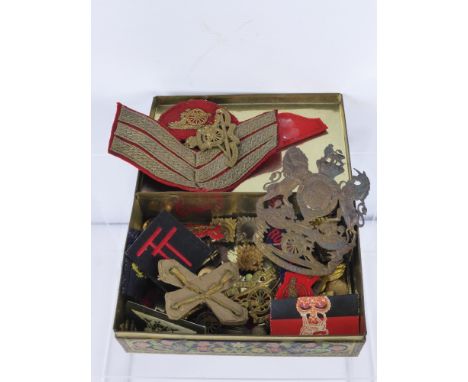 A Collection of Original Royal Artillery Military Insignia, including a Victorian helmet plate.