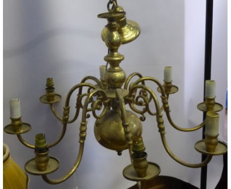 An Antique Eight Branch Brass Dutch Style Chandelier, central ball on turned column with eight scrolling branches, wired for 
