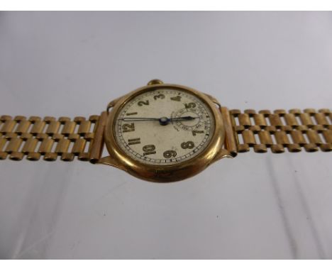 A Gentleman's 9 Ct Gold Vintage Swiss Made Wrist Watch, the watch having white face with gold painted numerals and seconds di