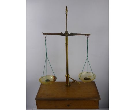 A Vintage Anometer in the original box, together with oak cased apothecary scales and S. Mawson & Sons glass medicine measure