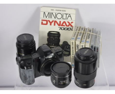 A Minolta Dinax 7000 i No. 16323609 Camera, with instruction manual and custom sling strap, Minolta AF lens 1 - 200, a Minolt