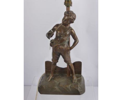 A Bronzed Lamp Base, depicting a boy playing a pipe, approx 36 cms high.