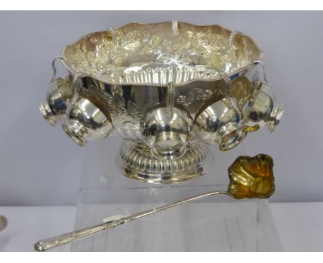 A Silver Plated Punch Bowl, embossed with floral design, lion mask handles with fluted bowl and pedestal base, eight punch cu