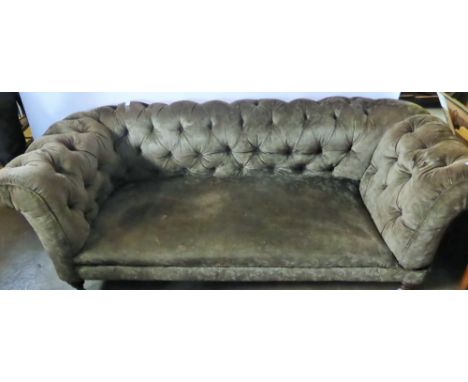 A Vintage Chesterfield Sofa, on turned legs.