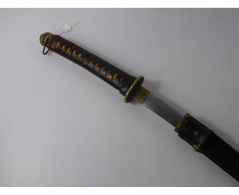 WWII Japanese Officer's Katana Sword, with shark skin and leather covered grip, brass tsuba. Blade in good condition and shar
