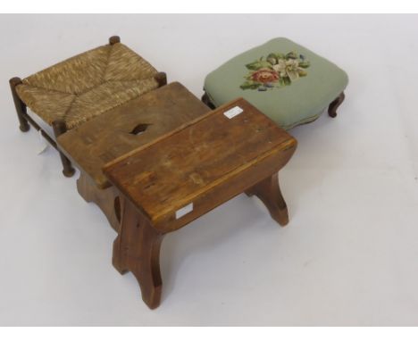 Two Foot Stools, one covered in tapestry, together with two vintage milking stools, one pine the other oak.