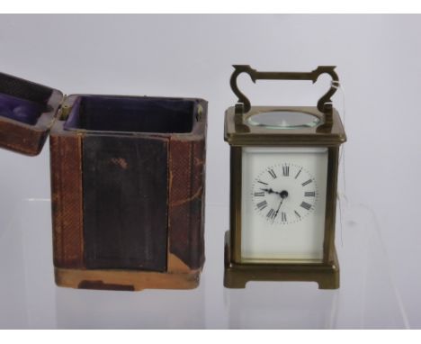 A Brass Carriage Clock, the mechanism stamped S.F.R.A., approx 15 cms high, in the original leather case with key.