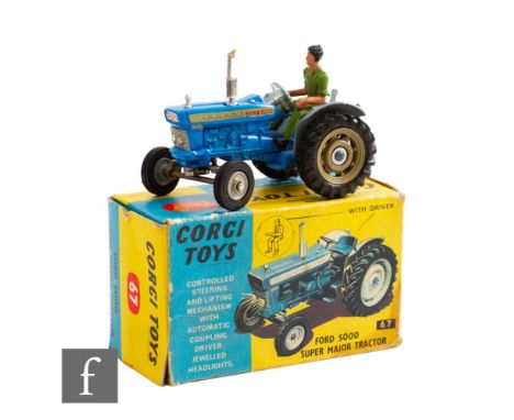 A Corgi 67 Ford 5000 Super Major Tractor in blue andgrey including mudguards and hubs, with figure driver, boxed. 