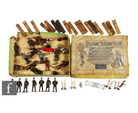 A Britains No.155 Gauge 1 Railway Station Staff Set comprising Station Master, Ticket Collector, four Porters, two Trolleys a