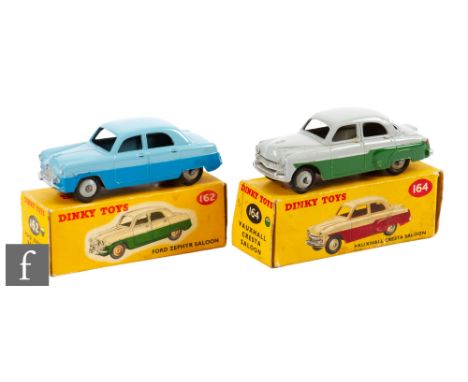 Two Dinky Toys diecast models, 162 Ford Zephyr in two-tone blue with grey ridged hubs, and 164 Vauxhall Cresta Saloon in two-