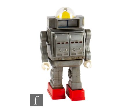 A 1970s Mego/Horikawa Giant Robot, battery operated plastic robot in grey with red feet, opening chest, domed head, height 40