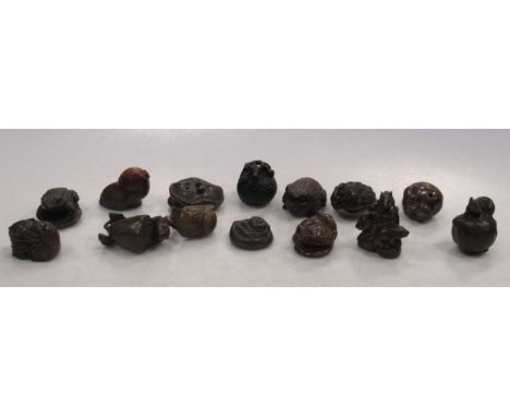 Fourteen carved wood netsuke including toads, rabbits and a toadstool (14)