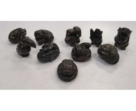 Ten carved wood animal netsuke including dogs and rats (10)