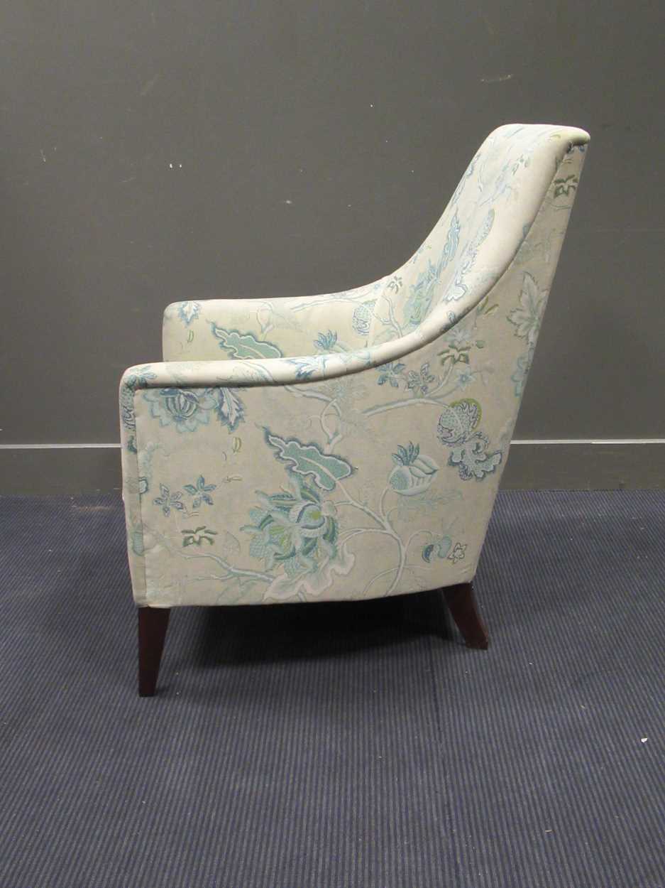 A WesleyBarrell armchair on square tapered legs in Cheffins Fine Art