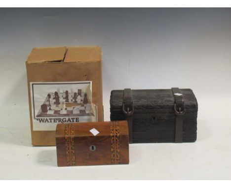 A moulded Watergate chess set with figural caricature pieces, a simulated wood trunk box, a domed caddy together with an earl