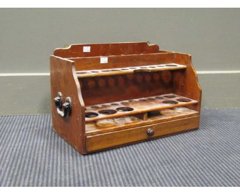 A wooden pipe rack 40.5cm wide and a leather hat box (hinge broken)