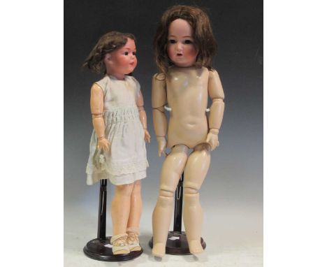 Simon and Halbig bisque head doll also marked K and R, 117 and another doll with a cracked head, plus a quantity of Mickey Mo