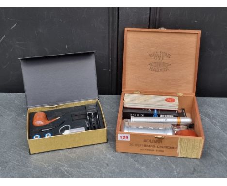 Cigars: a Romeo Y Julieta 'Churchill', in metal tube; together with a four Carlos V 'Double Coronas'; two eKaiser 'Rechargabl