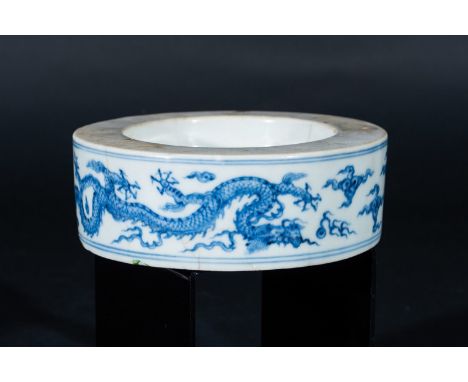 Chinese Art. A porcelain blue and white inkwell element painted with dragons chasing the flaming pearl China, Qing dynasty, 1