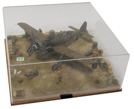 A cased diorama of a 1:32 scale Luftwaffe FW190-8 fighter and ground crew. 