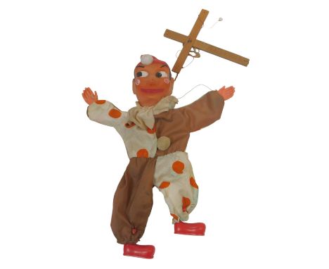 A hand painted celluloid court jester puppet. 