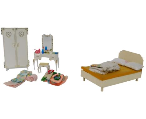 A Sindy by Pedigree two door wardrobe, a dressing table, a hand made bed, clothing and accessories.