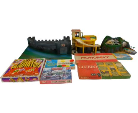 Toys and games, including a Fisher Price Garage, a wooden fort, Battling Gladiators board game, Merit Ludo and Snakes &amp; L