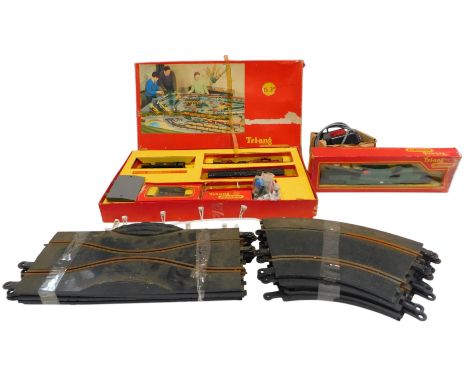 A Tri-ang Railways RS30 train set, a Tri-ang Railways R343 ?? rocket launcher, a Tri-ang Power Units power controller, and Sc