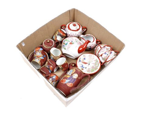 Box with 2 porcelain Japanese tea sets, including the brown ones with Giesha faces in the bottom of the cups