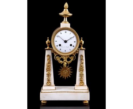 Empire marble column mantel clock with brass case, fittings and vases, marked on the dial Caron á Montpellier, 37 cm high, 18