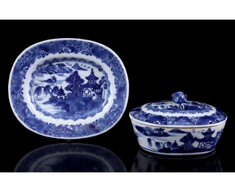 Porcelain oval lidded tray on a saucer with blue and white decor of a pagoda in a seascape and richly decorated rim, China ca