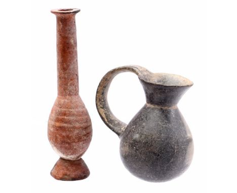 Earthenware red pipe vase with relief on the belly, 20 cm high and gray and white colored jug, 12 cm high, both objects presu