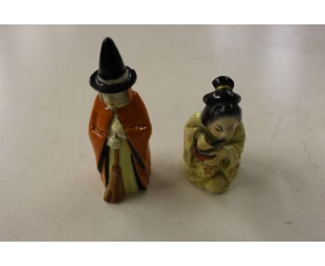 A Royal Worcester candle snuffer in the form of a witch; and another in the form of a Geisha girl