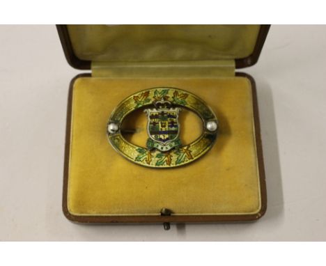 A Sterling silver and enamel decorated brooch depicting a Canadian crest 
