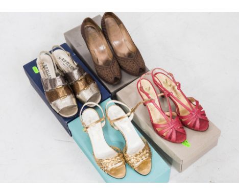 A group of four pairs of vintage lady's shoes including gold high heeled sandals and embroidered brown peep toes, all boxed