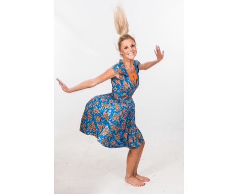 A 1950's floral print dress, in orange and blue with shawl collar