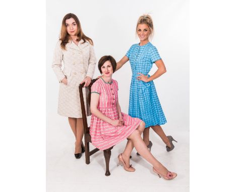 A group comprising a pink short sleeved dress printed with lines of rosebuds; a 1950's blue check day dress; a 1950's moderni