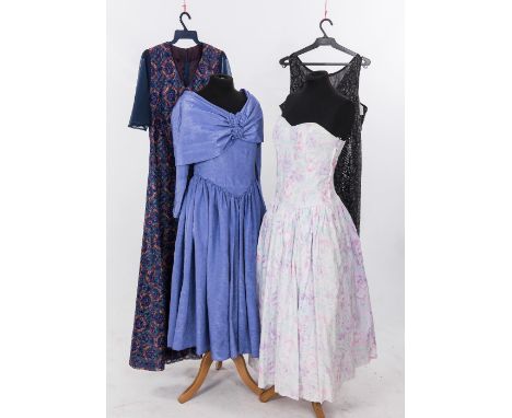 A group of four 1950's and 1960's dresses including a lilac cocktail dress with shawl collar, stylised floral print with chif