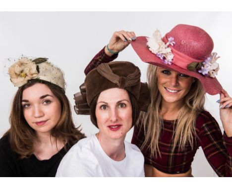 A hatbox containing four vintage hats including a brown velvet , a black sequinned evening hat, and a Mitzi Lorenz cream hat 