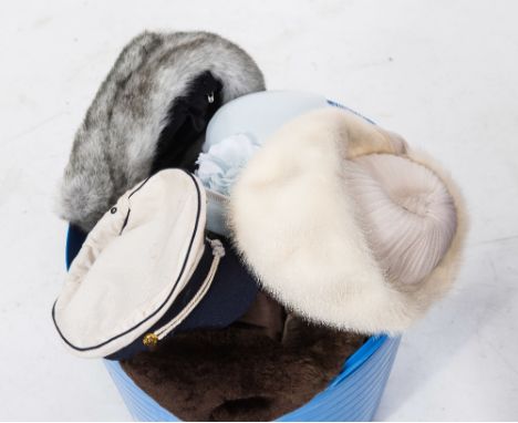 A large group of vintage hats including faux fur, sailor's cap etc