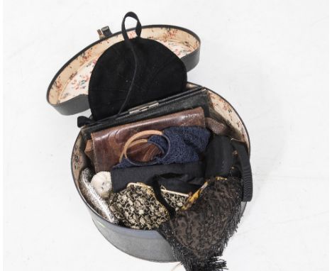 A hatbox containing a group of vintage evening bags including beadwork, brocade sequinned together with a number of other bag