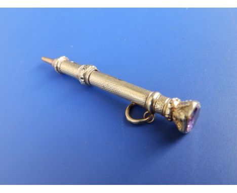 A yellow metal propelling pencil by Mordan &amp; Co. with amethyst end stone.